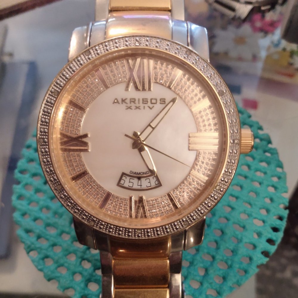 Akribos mother of pearl and genuine diamond face watch